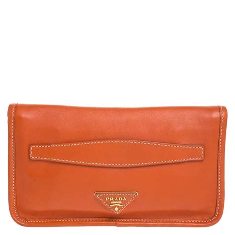 orange prada clutch|Prada leather clutches.